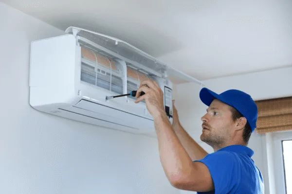 The man is repairing air conditioning.