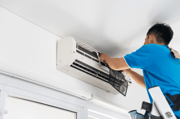 The expert is doing air conditioning servicing checklist.