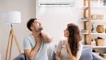 The couple is uncomfortable because of the carbon monoxide leaks from their air conditioning.
