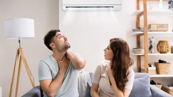 The couple is uncomfortable because of the carbon monoxide leaks from their air conditioning.