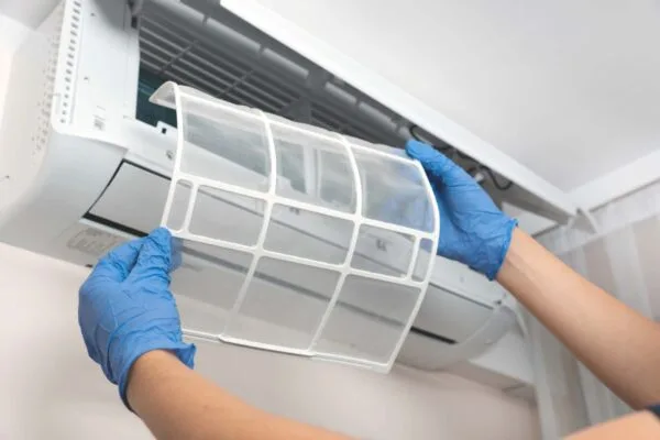 The hand is doing AC services in Gold Coast