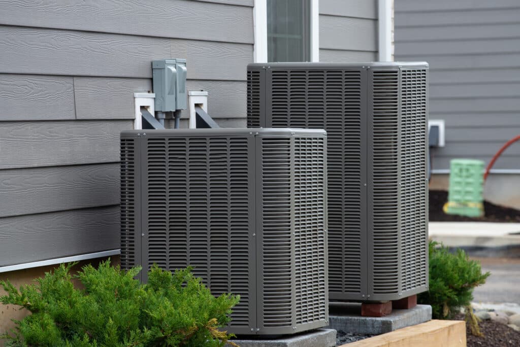 Modern HVAC units placed on elevated concrete pads, which may still experience failures if HVAC stops working suddenly.