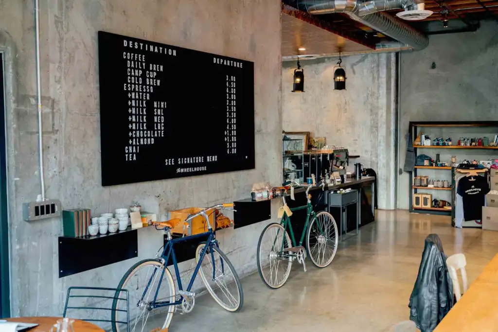Modern café interior with visible HVAC ducts, a reminder to upgrade your restaurant HVAC system for better efficiency.