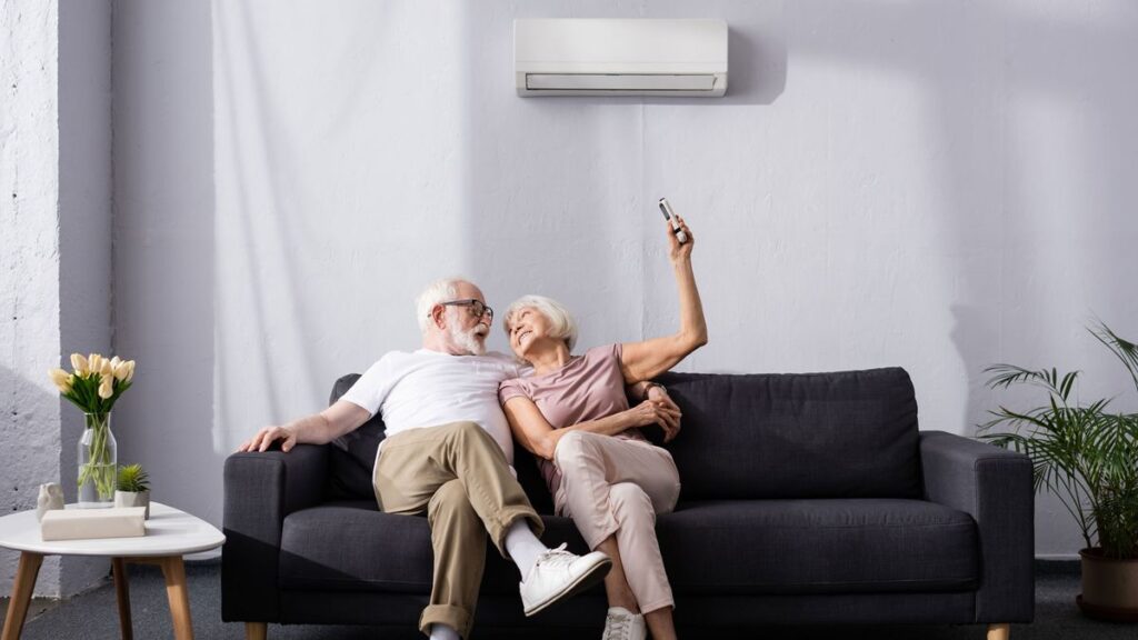 Two old people are enjoying under Daikin Inverter air conditioner.