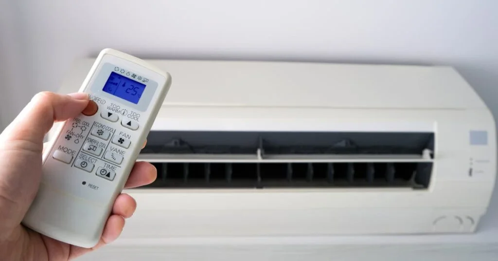 Activating Econo mode in air conditioner for energy-saving air conditioning in Gold Coast homes.
