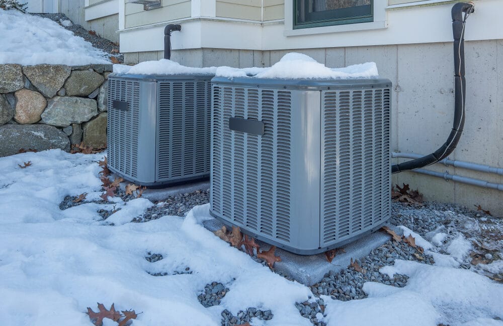 Prevent dry winter air with your HVAC system - which is standing in the snow.