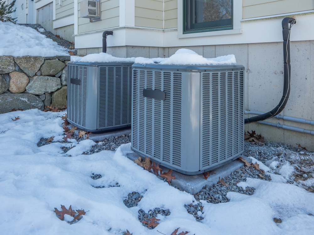 Prevent dry winter air with your HVAC system - which is standing in the snow.