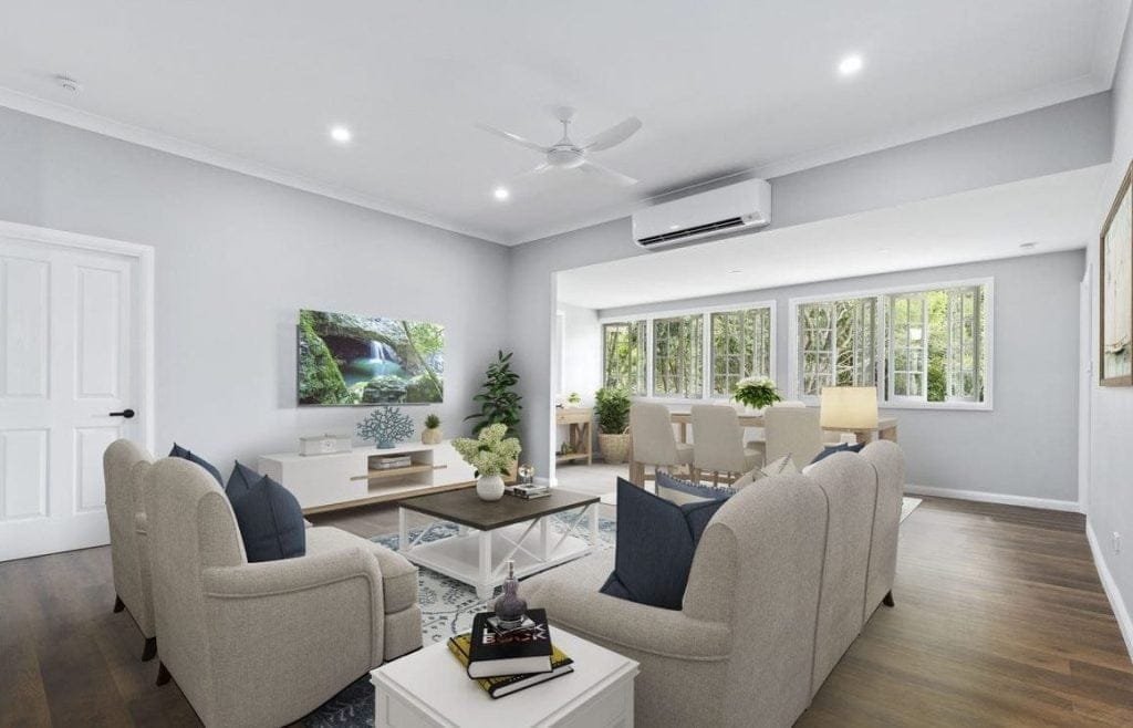 Living room with a ceiling fan and air conditioner both turned on to demonstrate how using a ceiling fan while the air conditioner is on can reduce energy consumption.
