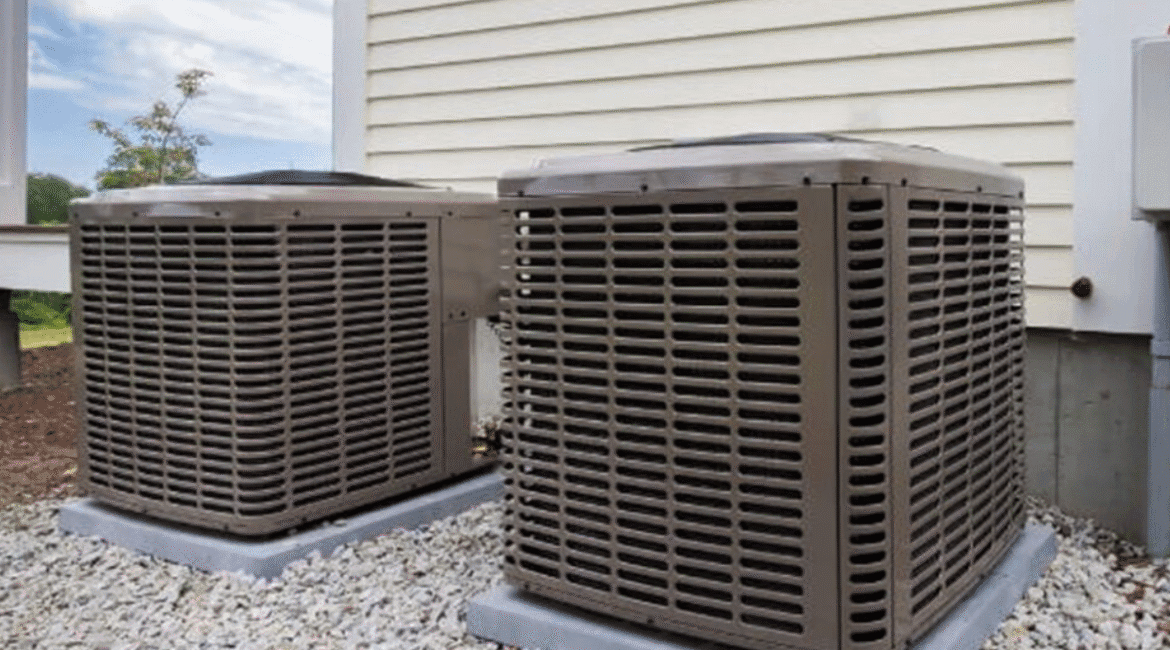 Two AC outdoor units mounted on concrete slabs – preventing common issues like AC outdoor unit leaks water in coastal climates like Gold Coast.