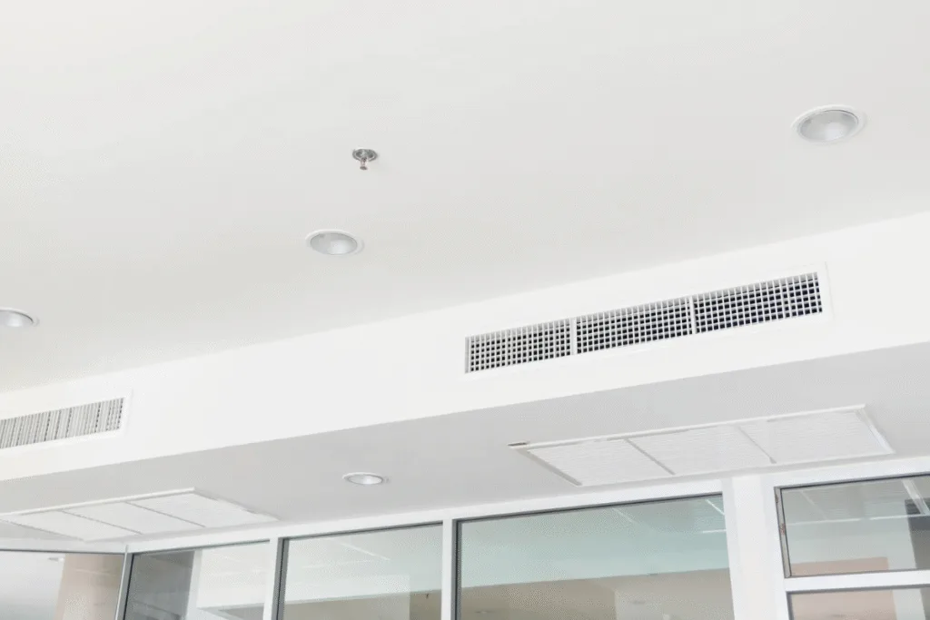Ducted air conditioning system in a modern hospital ceiling, offering zoned temperature control – a trusted choice of air conditioners for hospitals.