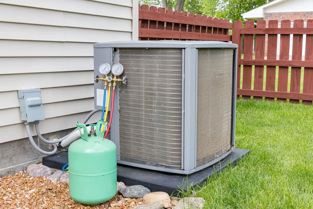 An air conditioning system in winter stands next to a regas equipment. 