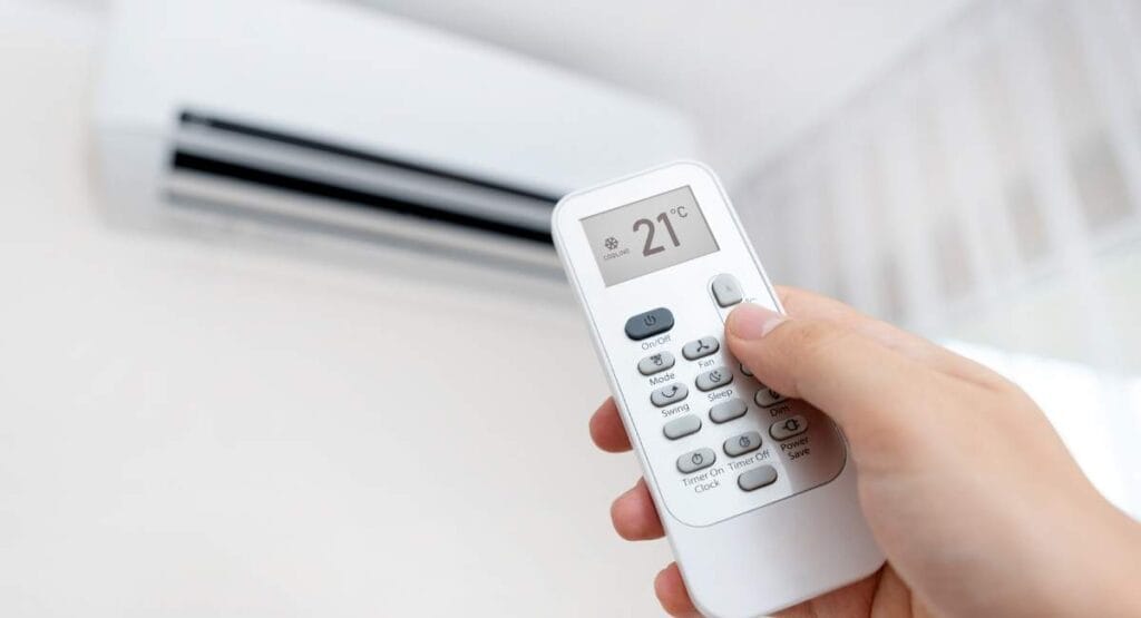 Using the remote to turn on heating mode at 21°C – a smart way to use the heating mode efficiently with AC Gold Coast services.
