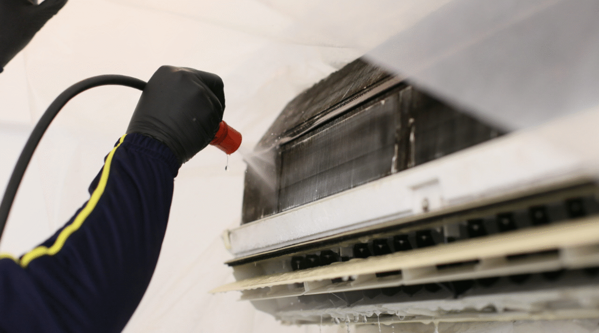 Hydro Clean vs standard servicing - The technician is cleaning customer's air conditioner
