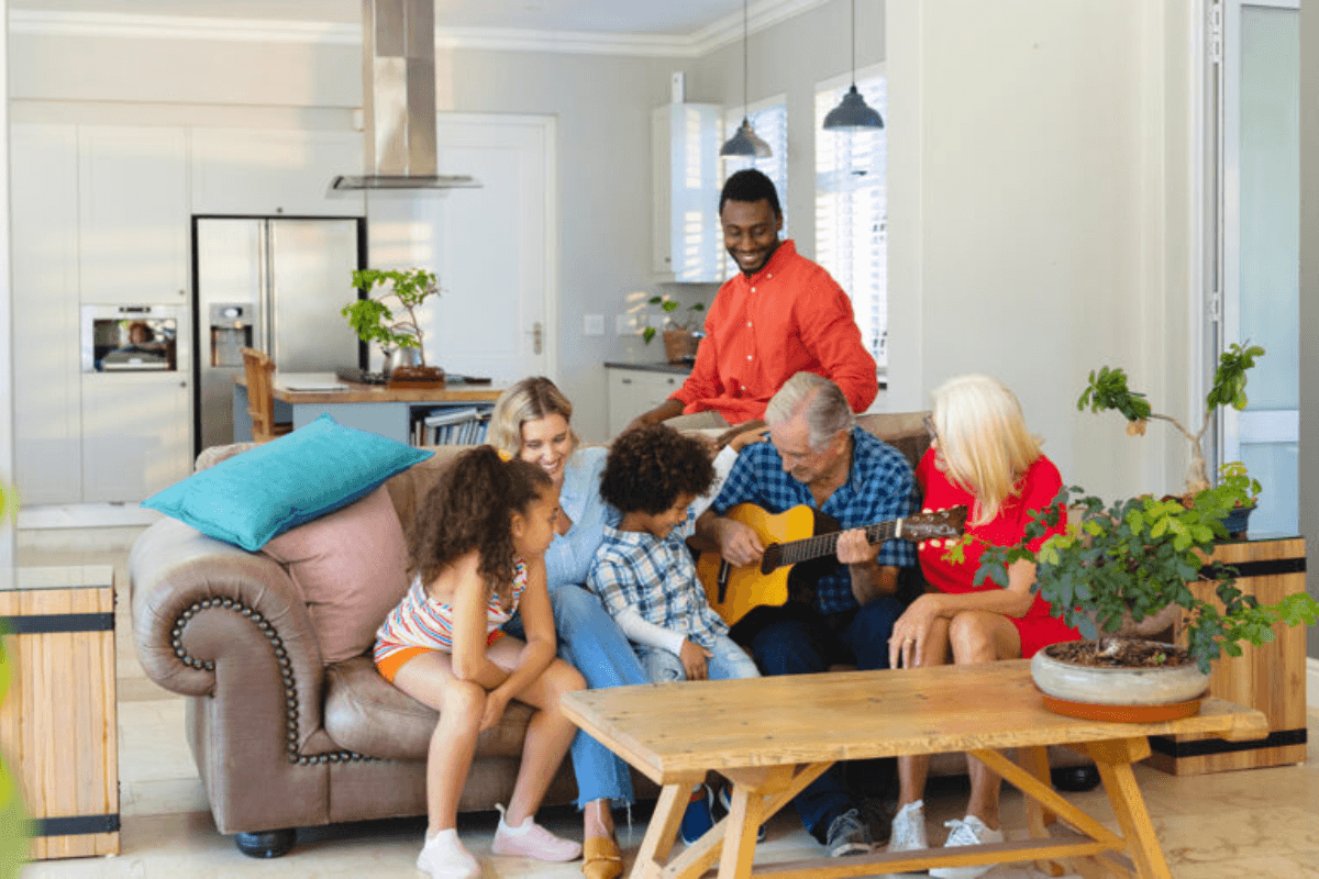 The family is standing in the center of living room