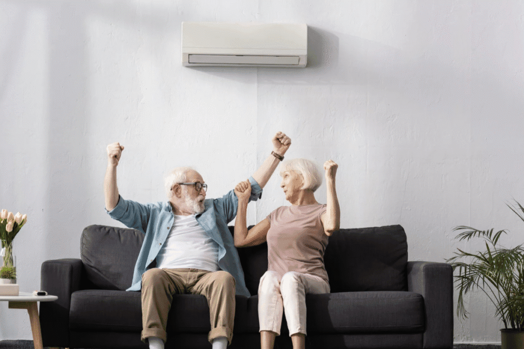 Couple of the older is sitting under air conditioner