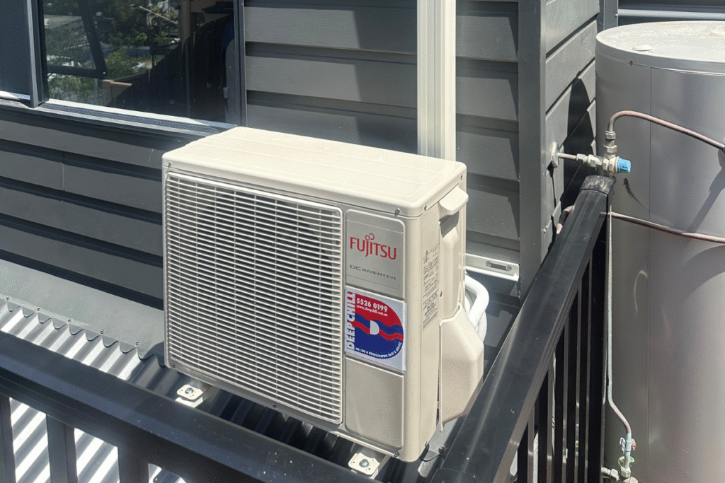 Vermin treatment and pest prevention for Fujitsu outdoor AC unit, part of preventative maintenance and professional air conditioning service Gold Coast.