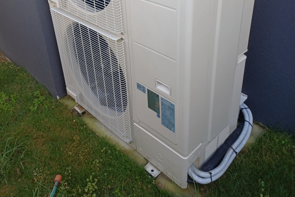 Outdoor air conditioning system protected through vermin treatment and pest prevention, supported by preventative maintenance and air conditioning service Gold Coast.