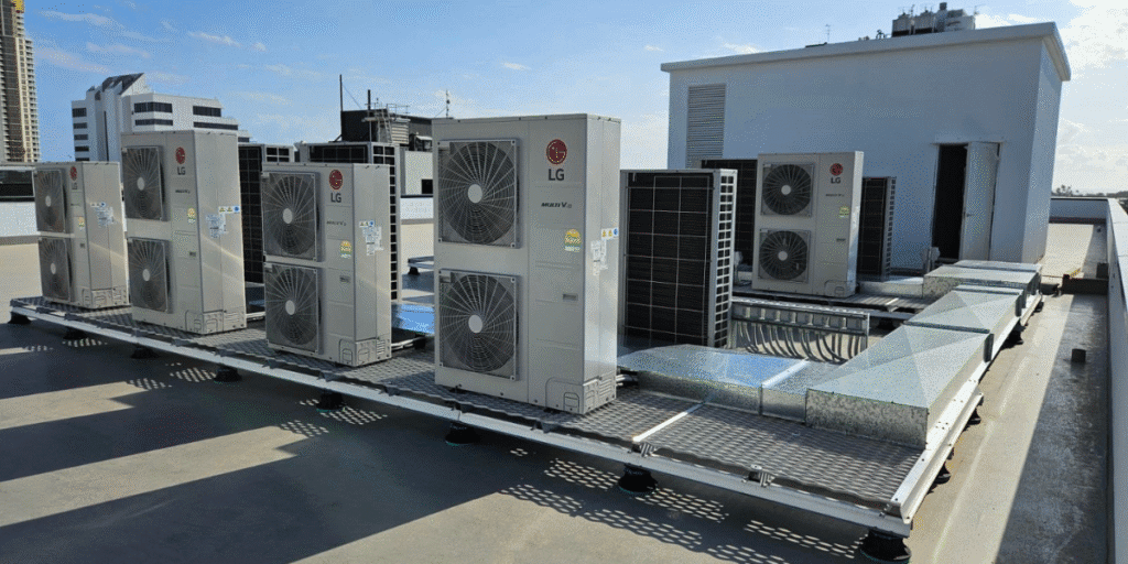 Commercial rooftop LG units installed for air conditioning Gold Coast buildings, highlighting how AC is using too much electricity without proper maintenance.