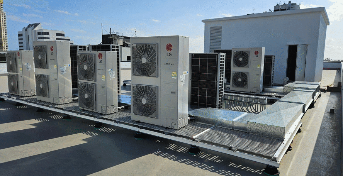Commercial rooftop LG units installed for air conditioning Gold Coast buildings, highlighting how AC is using too much electricity without proper maintenance.