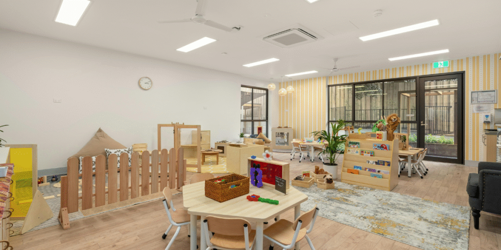 A bright Gold Coast classroom designed for young children with modern furniture and ceiling air conditioning for childcare centres.