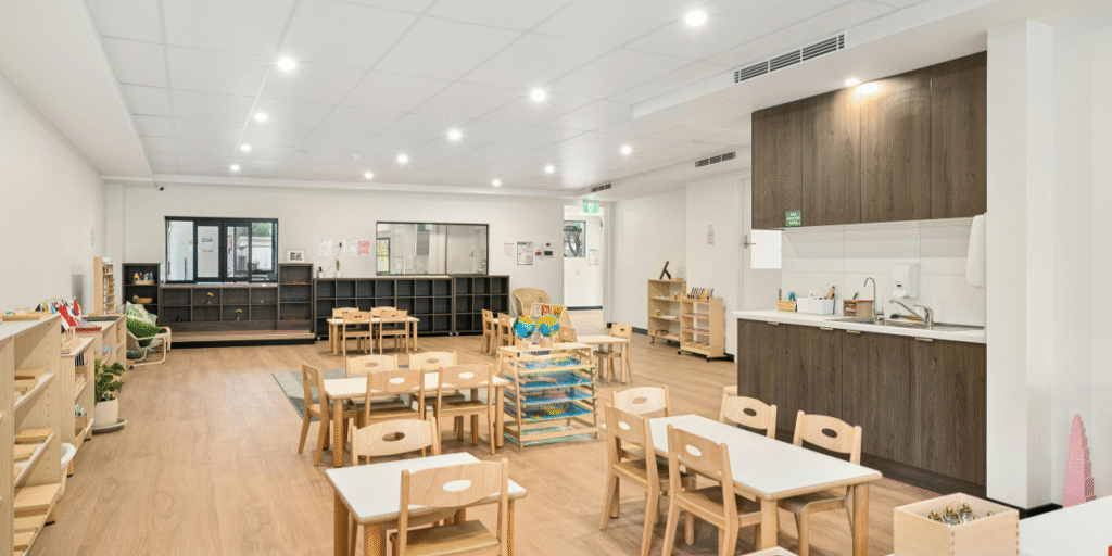 Spacious childcare centre learning area featuring childcare air conditioners for a healthy indoor climate. Frequent cleaning and preventative maintenance are essential, with expert air conditioning Gold Coast care.