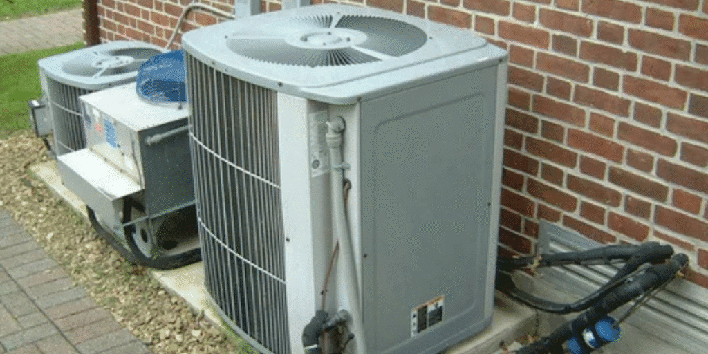 Old outdoor condenser units showing signs of wear, often needing recharge old air conditioner service from air conditioning Gold Coast experts.