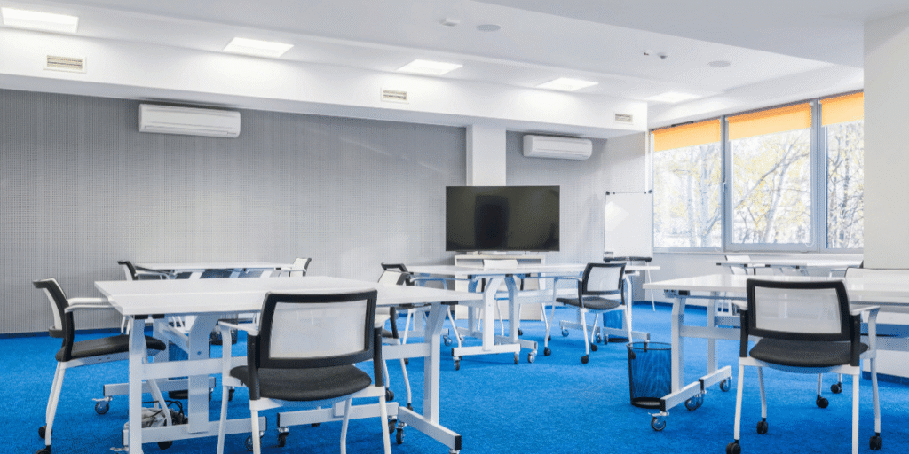 Modern classroom with multiple AC units maintaining the right temperature for primary school classrooms, supported by trusted air conditioning Gold Coast services.