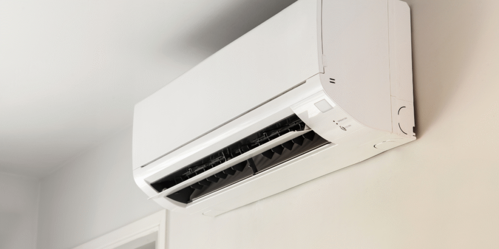 Wall-mounted split air conditioner unit blowing warm air instead of cooling — a common issue that needs quick air conditioning repair service Gold Coast assistance to restore comfort and fix ac starts blowing hot air problems.