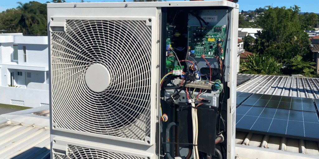 LG outdoor unit not running — rooftop inverter system opened for electrical board and wiring inspection, serviced by DEEPCHILL air conditioning Gold Coast experts.