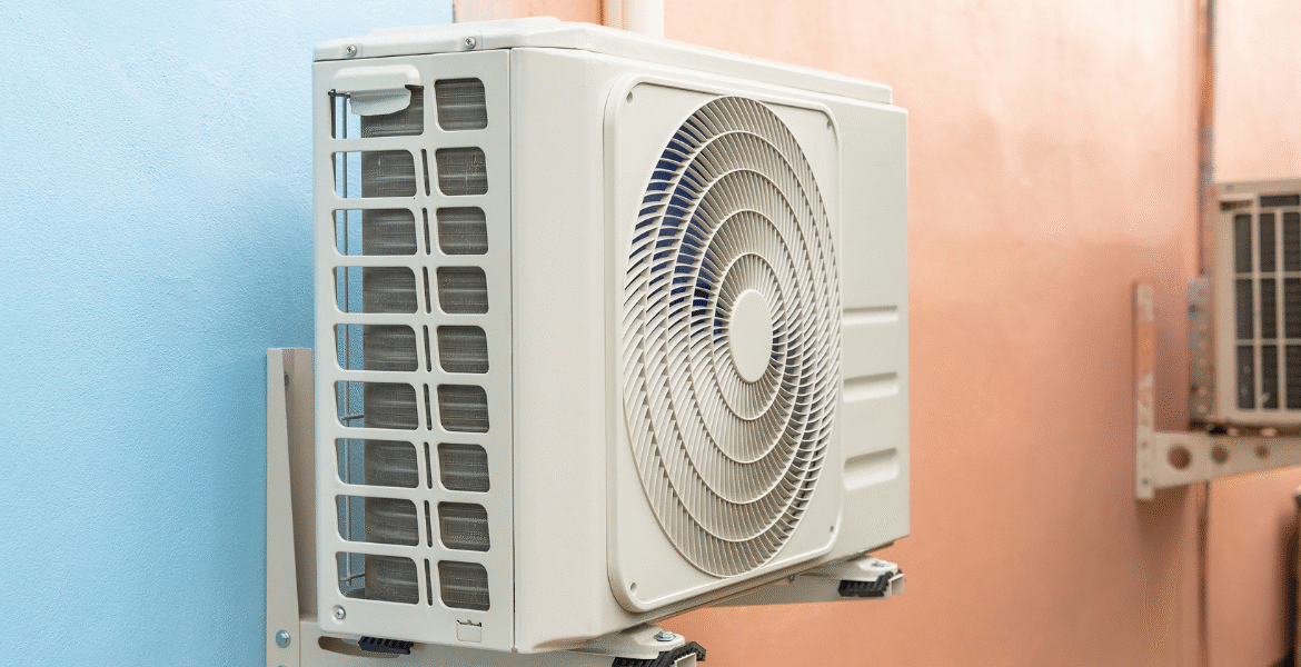 Outdoor air conditioning unit mounted on a school wall as part of Maintenance Plans for School Air Conditioners, ensuring reliable cooling performance and energy efficiency. Trusted air conditioning Gold Coast services by DEEPCHILL.