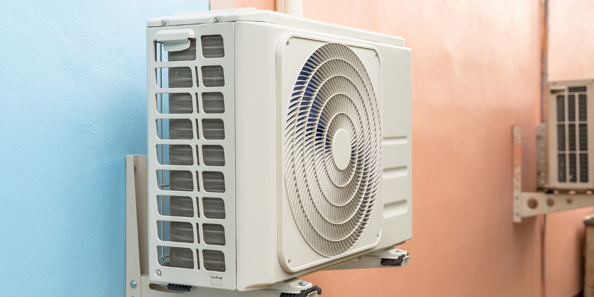 Outdoor air conditioning unit mounted on a school wall as part of Maintenance Plans for School Air Conditioners, ensuring reliable cooling performance and energy efficiency. Trusted air conditioning Gold Coast services by DEEPCHILL.