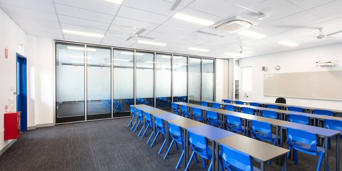 Modern high school classroom equipped with efficient air conditioning Gold Coast system — proving cool classrooms close learning gap and support better exam performance.