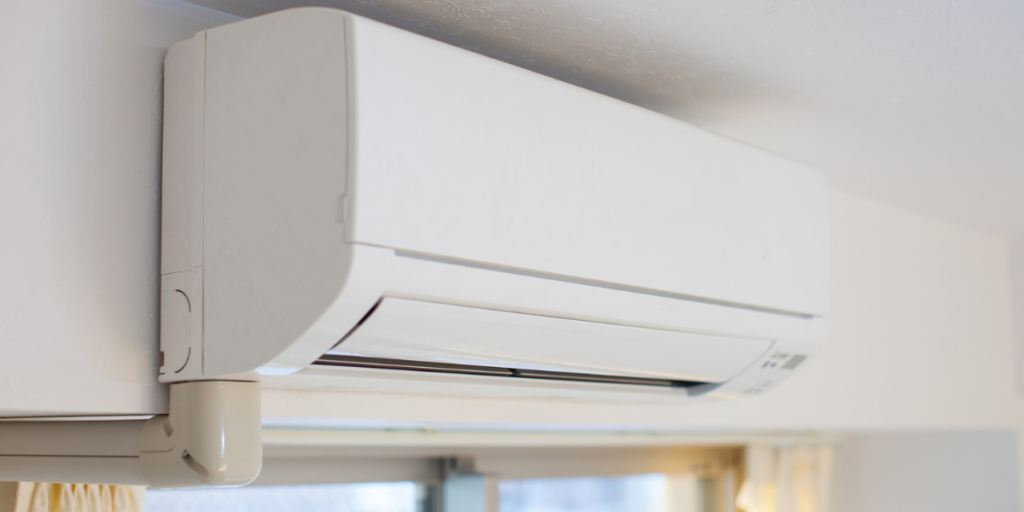 Wall-mounted split system air conditioner in a classroom setting, illustrating how efficient systems can help reduce school energy costs with air conditioning Gold Coast solutions.