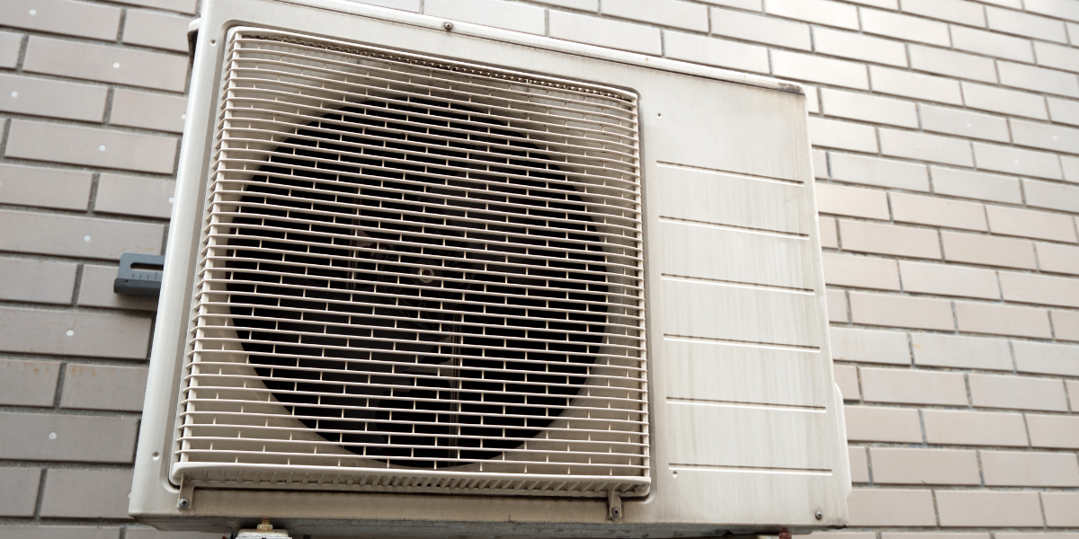 Wall-mounted outdoor air conditioner unit exposed to rain and humidity, illustrating how rain to get into the outdoor air conditioner unit does not cause damage – air conditioning Gold Coast.