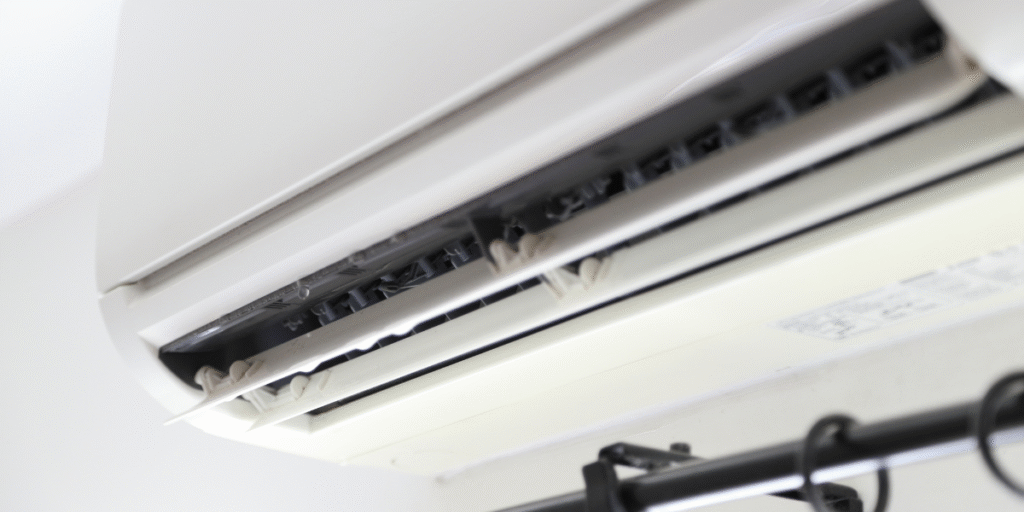 Indoor air conditioner panel opened with water leaking from the evaporator area, demonstrating an air conditioner leaking water during the holiday. DEEPCHILL provides air conditioning Gold Coast and commercial air conditioning Gold Coast services.