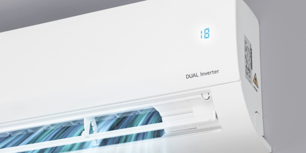 A close-up of a dual inverter air conditioner set to 18°C, demonstrating efficient systems that can safely leave your air conditioner all day, recommended by air conditioning Gold Coast professionals.