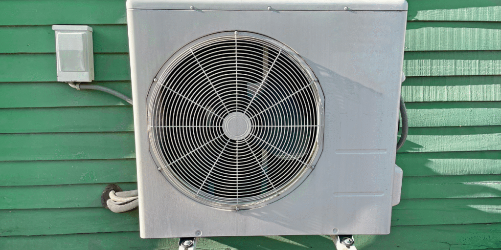 Outdoor air conditioning unit working hard to run AC during the heat wave on a Gold Coast home, maintained by professional air conditioning Gold Coast services.