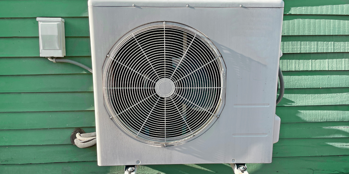 Outdoor air conditioning unit working hard to run AC during the heat wave on a Gold Coast home, maintained by professional air conditioning Gold Coast services.