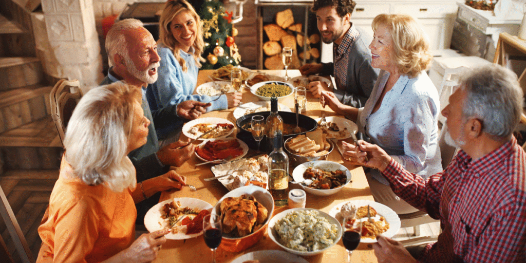 A happy family enjoying Thanksgiving dinner in a comfortable home after completing their thanksgiving air conditioner cleaning with help from an air conditioning service Gold Coast.