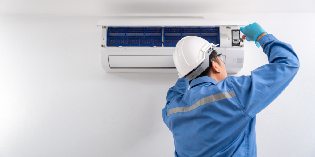 DEEPCHILL’s preventative maintenance different approach, with a licensed technician carefully inspecting an indoor air conditioning unit for performance and safety in air conditioning Gold Coast homes and businesses.