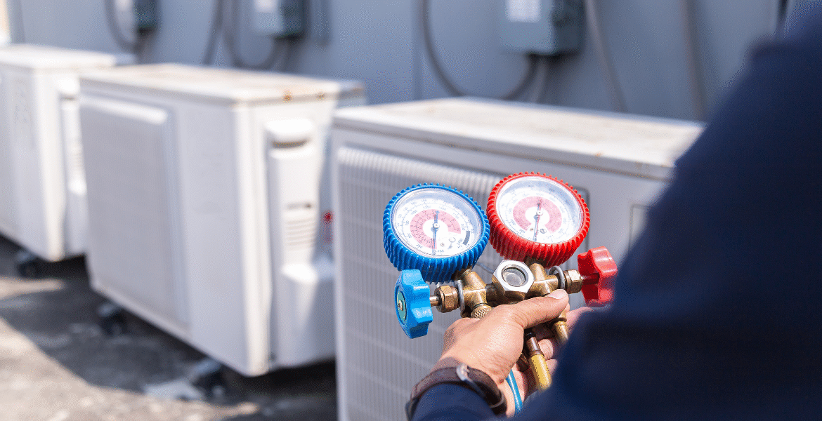 Technician checking an outdoor AC unit without connect gauges during preventative maintenance, a safe practice for air conditioning Gold Coast systems.