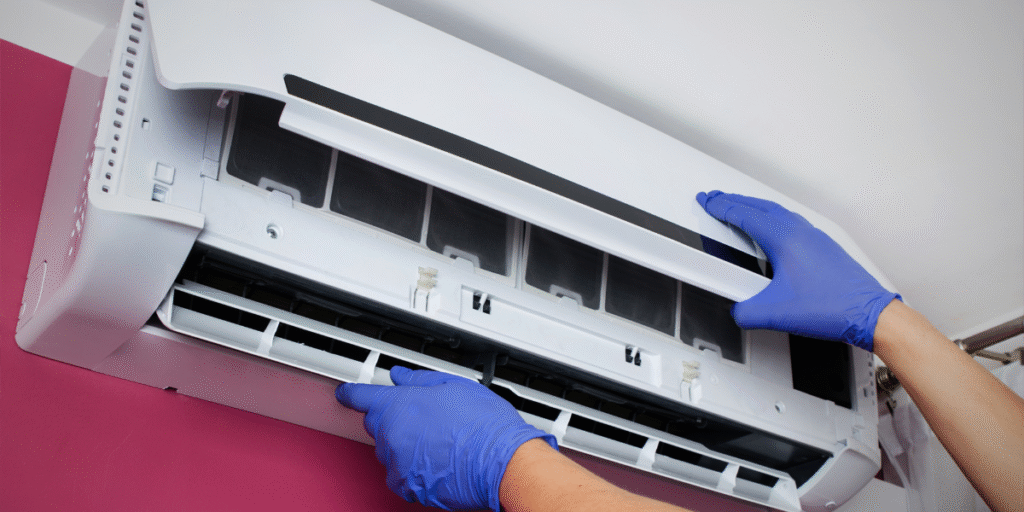 Preventative maintenance before Christmas & New Year for air conditioning Gold Coast, with technicians checking internal components before the busy holiday season.