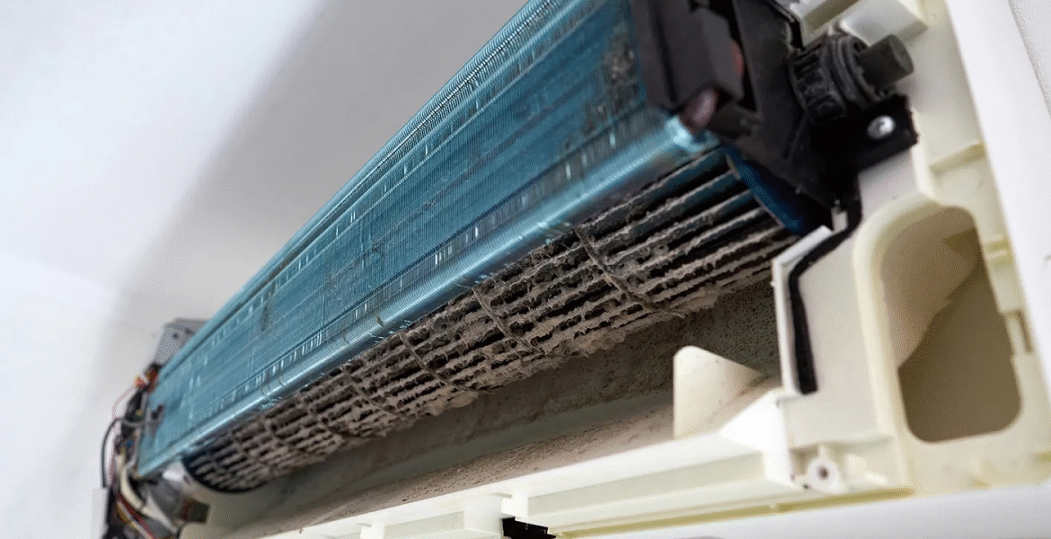 Mould buildup on a dirty indoor AC barrel fan, showing severe dust and contamination inside an air conditioning Gold Coast unit used in both residential air conditioning Gold Coast and commercial air conditioning Gold Coast.