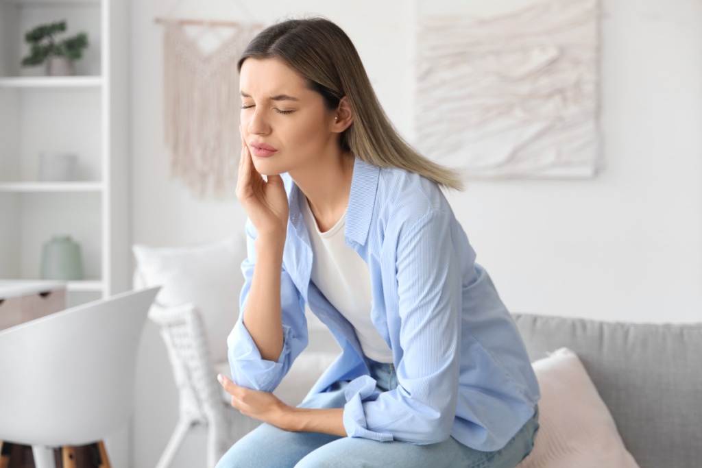 Headache and facial discomfort caused by possible refrigerant poisoning from poor indoor air quality in residential air conditioning Gold Coast environments.