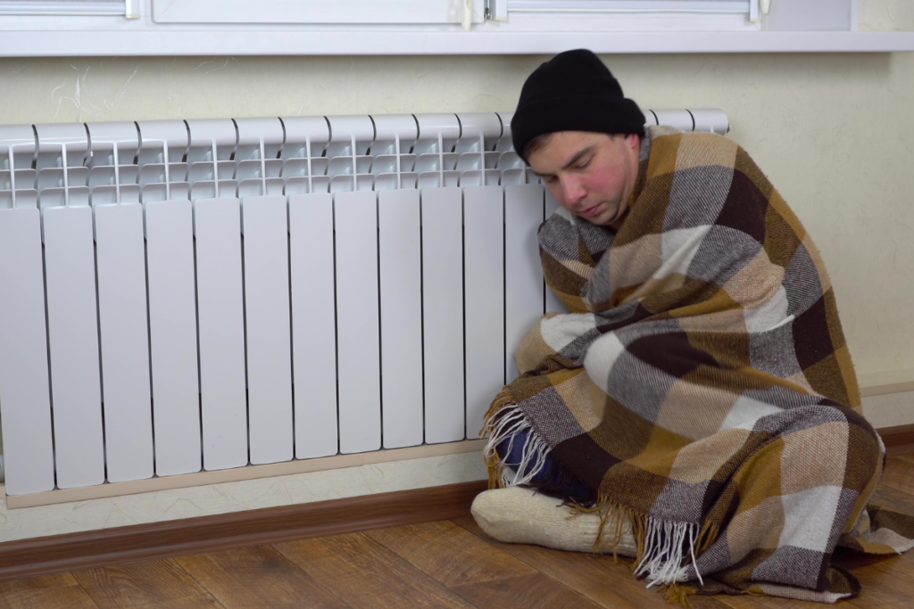 A person feeling unwell with a summer cold after staying in cold indoor air, showing how air conditioning Gold Coast settings can affect health.