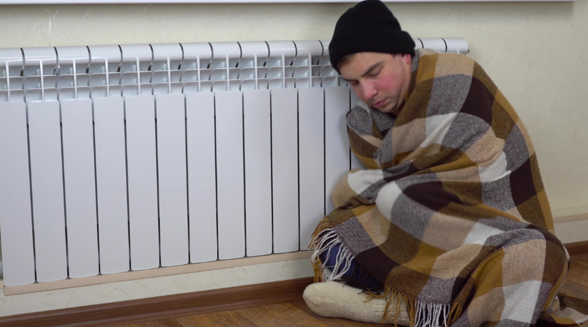 A person feeling unwell with a summer cold after staying in cold indoor air, showing how air conditioning Gold Coast settings can affect health.