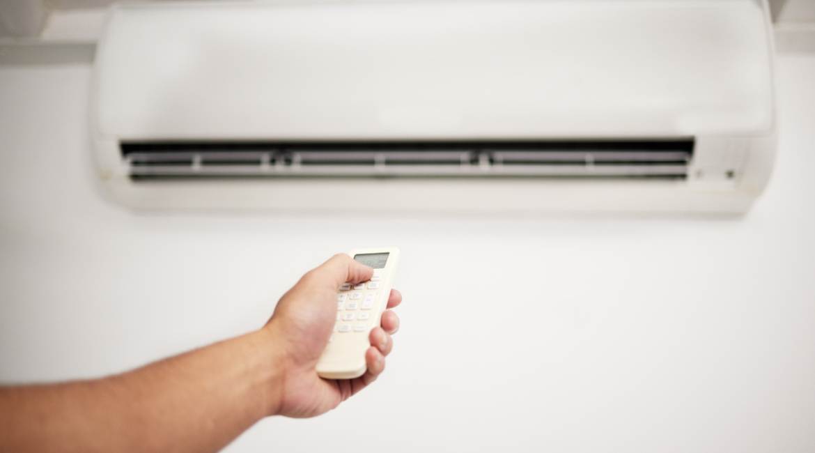 Remote-controlled split air conditioner installed in a living space, ideal example for Panasonic Vs Fujitsu comparison in residential air conditioning Gold Coast setups.