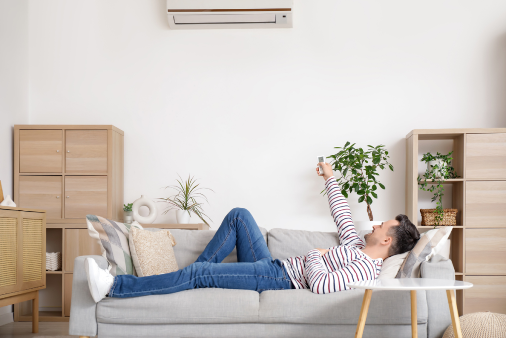 Turn off air conditioner during mild autumn weather, showing how Gold Coast homeowners adjust cooling habits as temperatures become more comfortable.