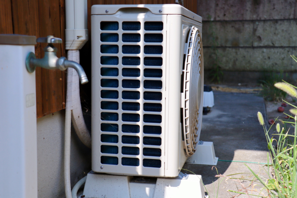 Outdoor condenser unit ready for upgrade as homeowners replace your air conditioner in early fall, air conditioning Gold Coast residential and commercial service.