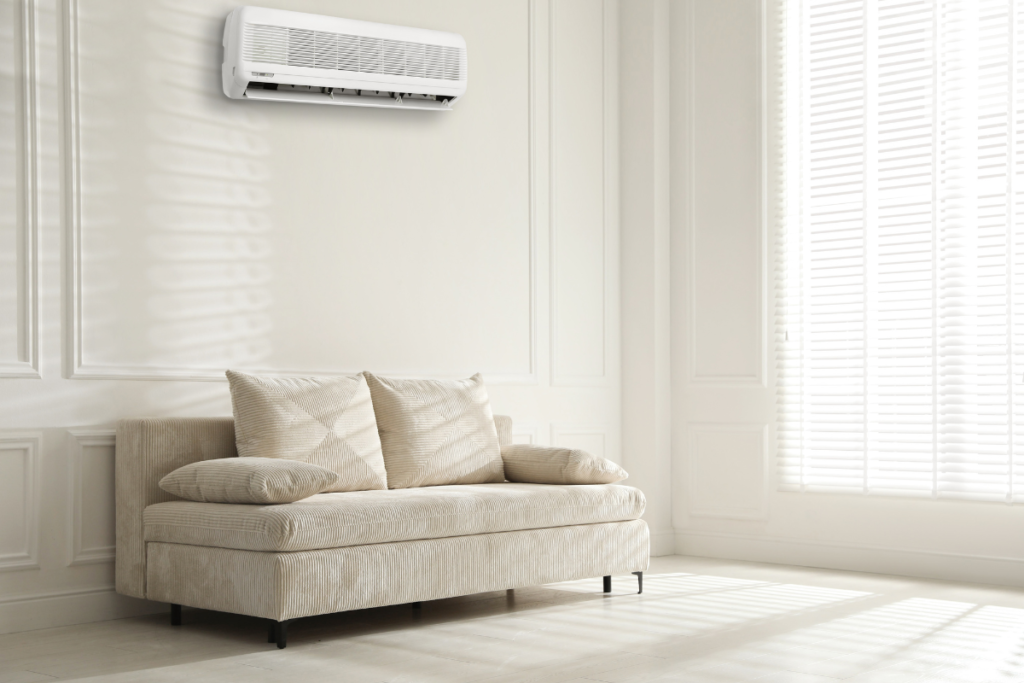 Minimal living room with split system highlighting what temperature should I set my air conditioner in fall at night for air conditioning Gold Coast homes.